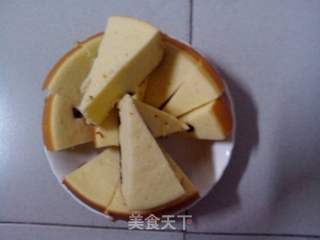 松软可口色泽金黄的———电饭锅海绵牛奶葡萄干蛋糕的做法步骤：12