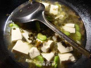 雪菜蚕豆豆腐羹的做法步骤:9