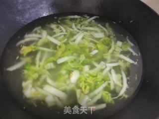 娃娃菜海鲜粥的做法步骤:7